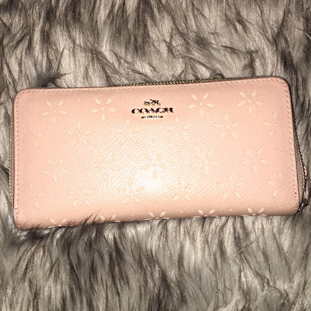 Pink sparkly coach wallet.